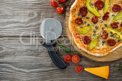 Various species with pizza arranged on wooden tray