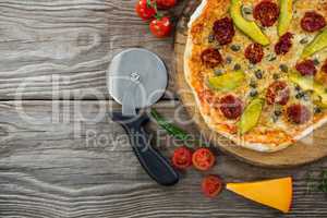 Various species with pizza arranged on wooden tray