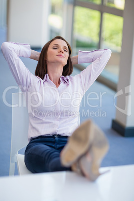 Businesswoman relaxing at desk