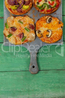 Various delicious italian pizza served on pizza tray