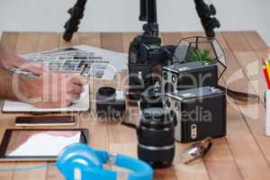 Male photographer working at desk
