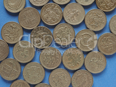 Pound coins, United Kingdom over blue