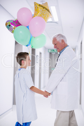 Doctor walking with patient