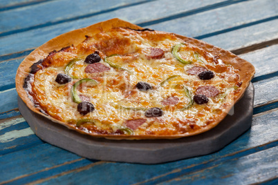 Delicious italian pizza served on pizza tray