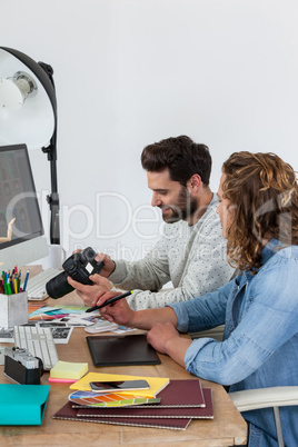 Photographers working together at the desk