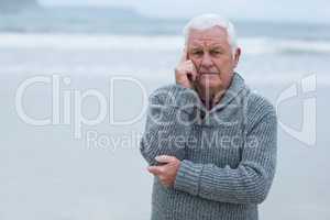 Portrait of senior man standing on the beach