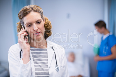 Doctor talking on mobile phone