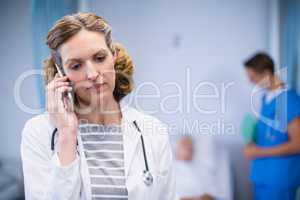 Doctor talking on mobile phone