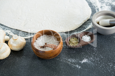 Pizza dough with various ingredients