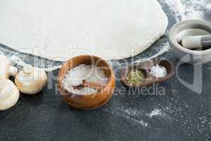 Pizza dough with various ingredients