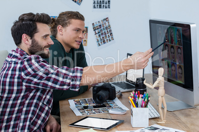 Photographers working at desk