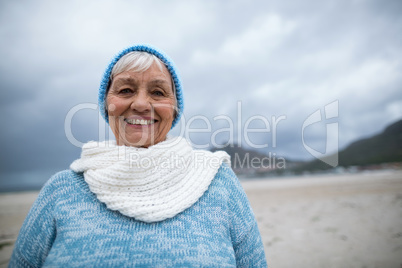 Portrait of senior woman standing on the beach