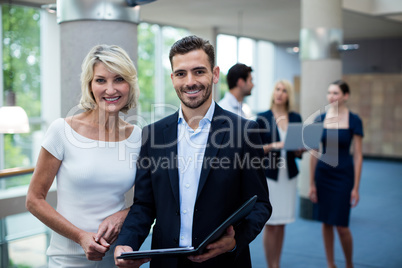 Portrait of business executives smiling at camera