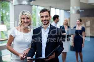 Portrait of business executives smiling at camera