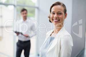 Cheerful businesswoman at conference centre