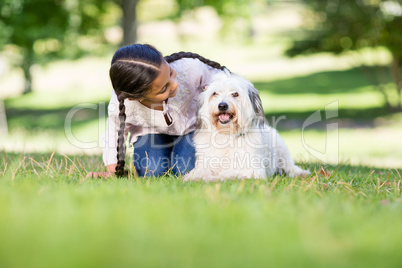 Girl playing with her pet dog