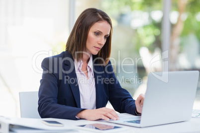 Businesswoman using laptop