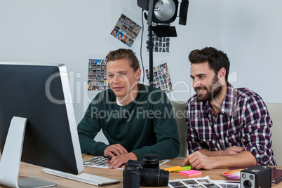 Photographers working at desk