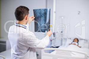 Doctor examining x-ray of patient