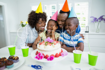 Family celebrating birthday party at home