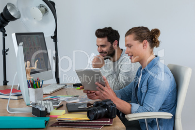 Photographers working together at the desk