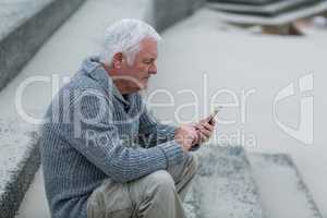 Senior man using mobile phone