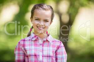 Portrait of a girl smiling in park