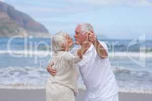 Senior couple having fun together at beach