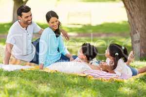 Happy family enjoying together in a park