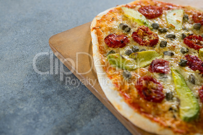 Close-up of pizza served on a pizza tray