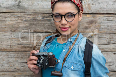 Female photographer with old fashioned camera