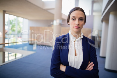 Confident businesswoman with arms crossed