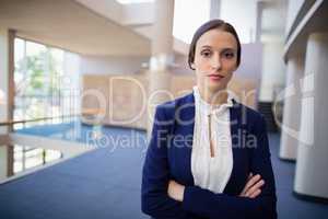 Confident businesswoman with arms crossed