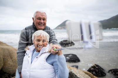 Senior couple taking a selfie from selfie stick