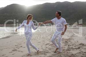 Mature couple having fun together at beach