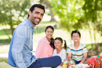 Happy family enjoying together in park Happy family enjoying together in park