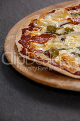 Delicious italian pizza served on wooden board