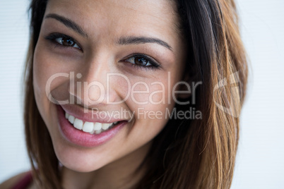 Happy female photographer in studio