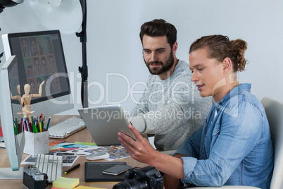 Photographers working together at the desk