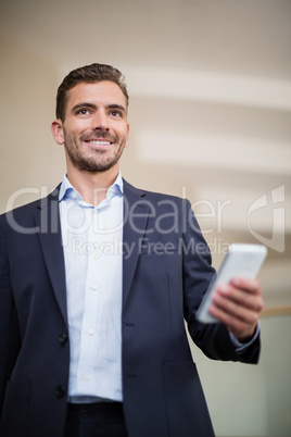 Businessman holding a mobile phone