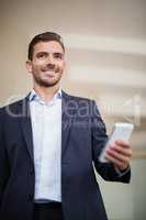 Businessman holding a mobile phone