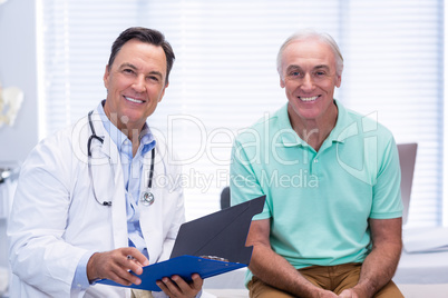 Portrait of smiling doctor and senior patient