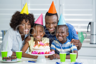 Happy family celebrating birthday party at home