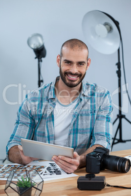 Photographer working over digital tablet