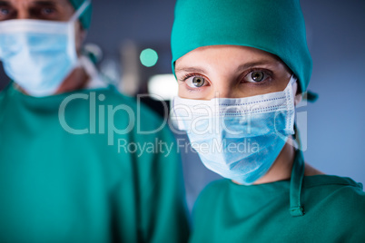 Portrait of female surgeon standing in a operating room