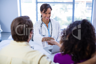 Doctor and woman shaking hands