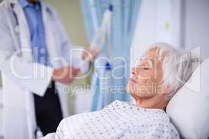 Senior patient sleeping on a bed