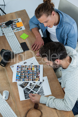 Photographers working together at desk