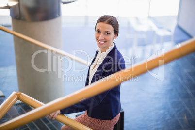 Businesswoman climbing steps