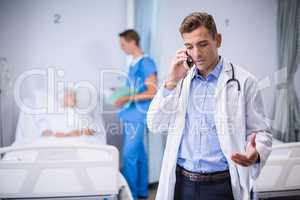 Doctor talking on mobile phone